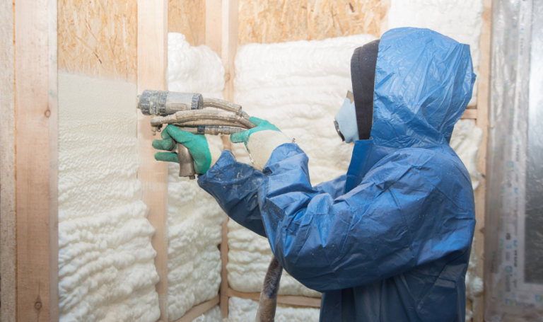 someone applying spray foam insulation
