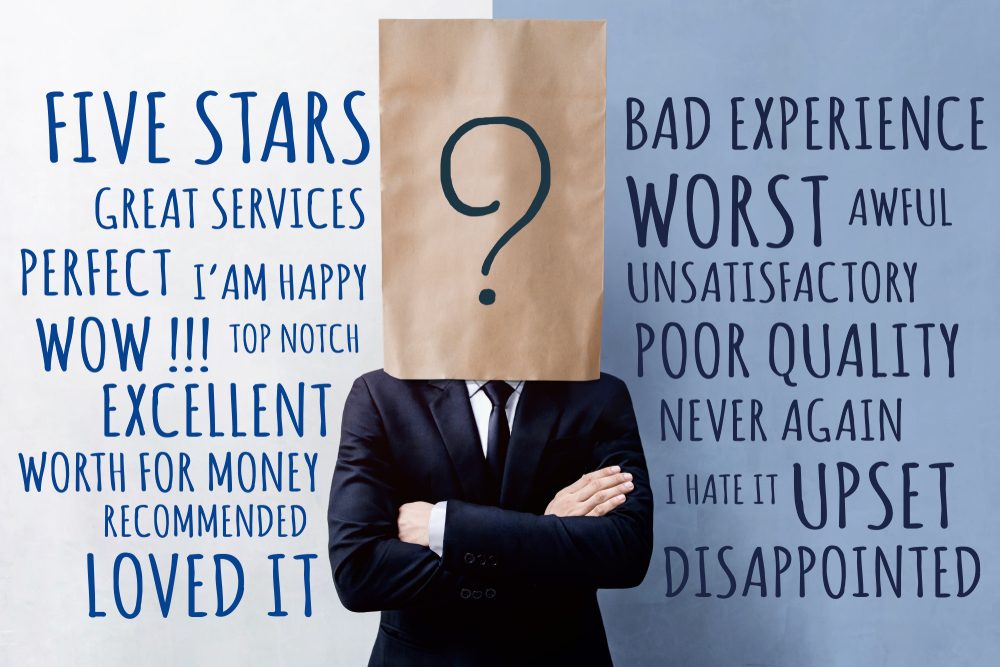 Person with paper bag over head, positive and negative feedback words in background